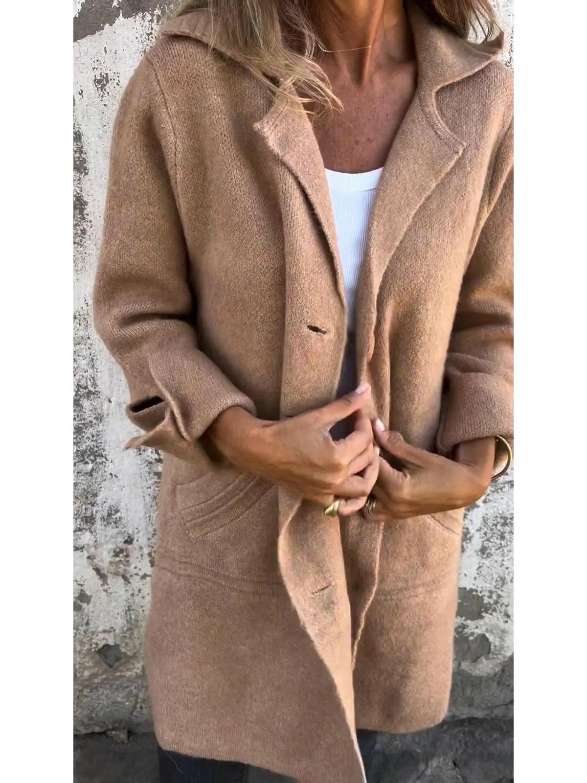 Green Lumina Wear Ada long knit coat displayed on a model, showcasing its stylish and cozy design.