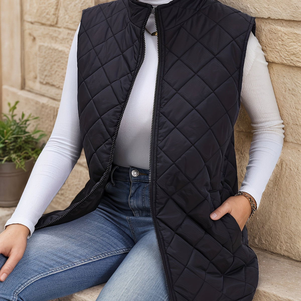 Black diamond quilted longline gilet with zip front, front view
