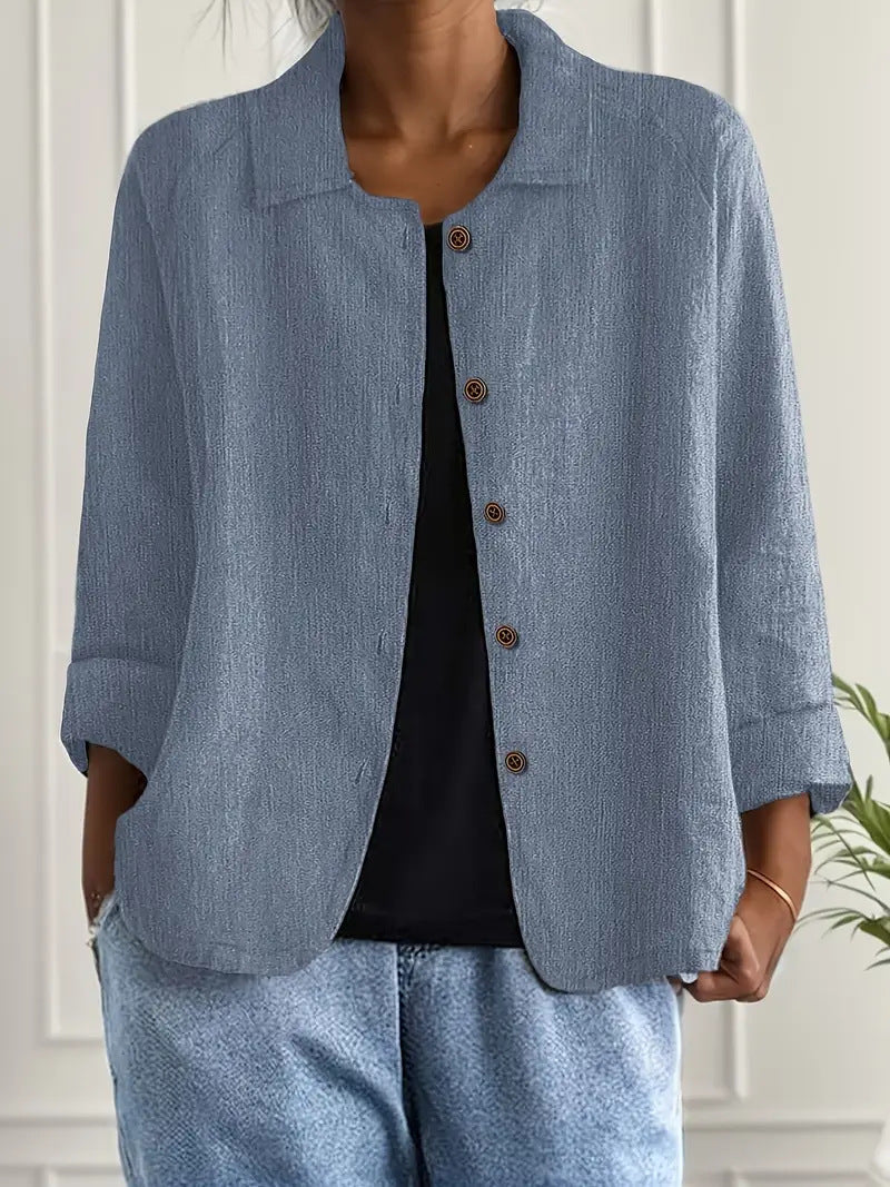 Person wearing a light blue jacket and pants with a white background