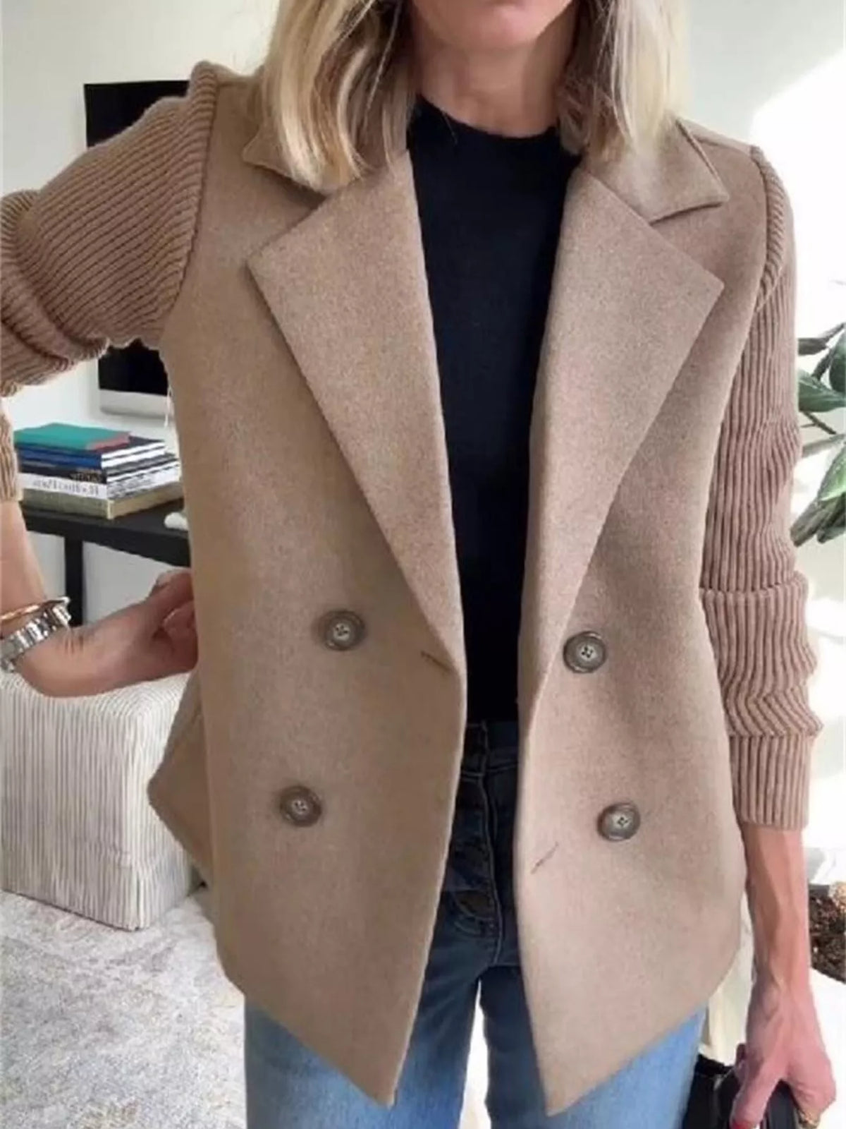 Double breasted short coat with shawl collar and knit cuffs, front view