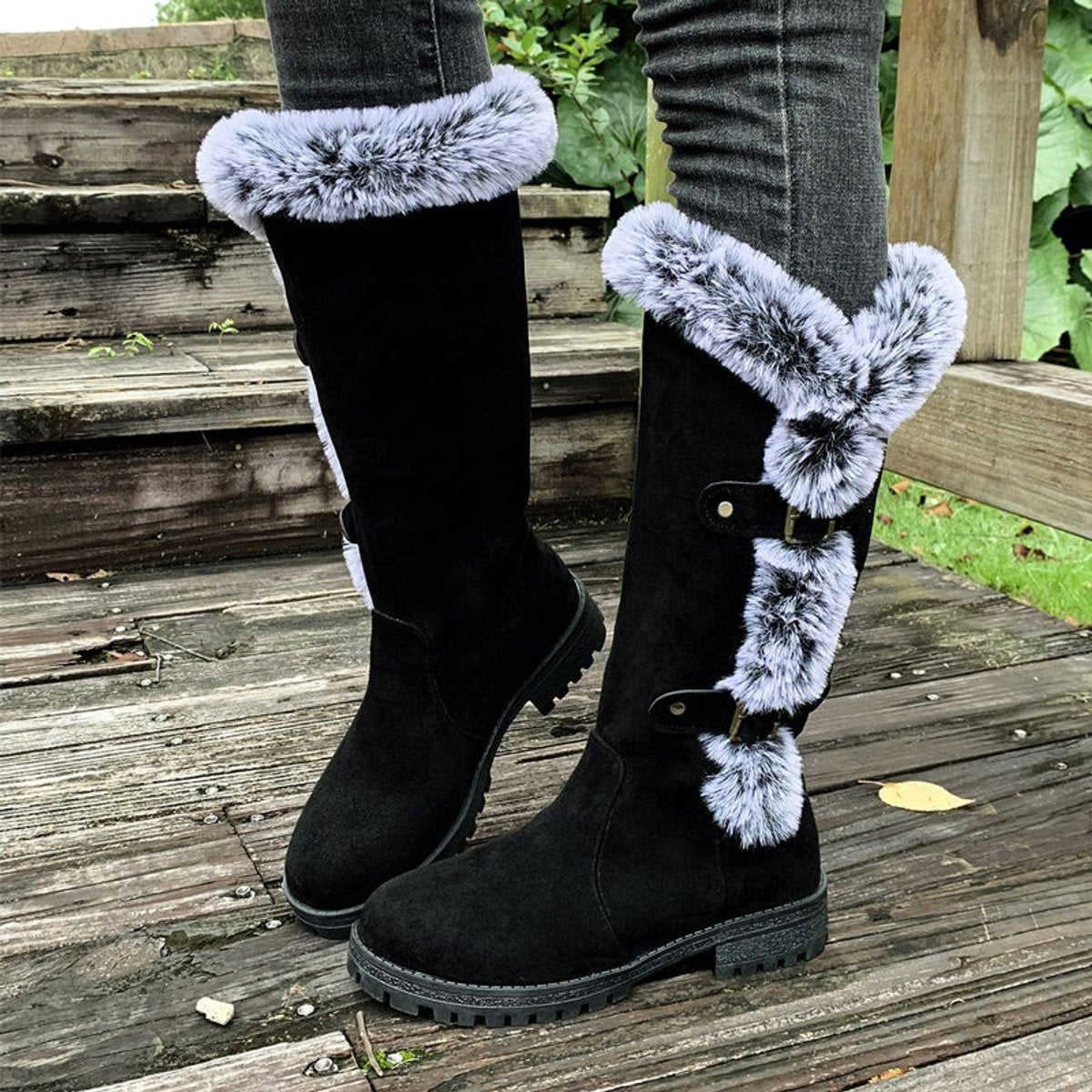 Black knee high boots featuring plush faux fur trim and adjustable buckle straps, perfect for women seeking stylish and warm long boots for cold weather. 0