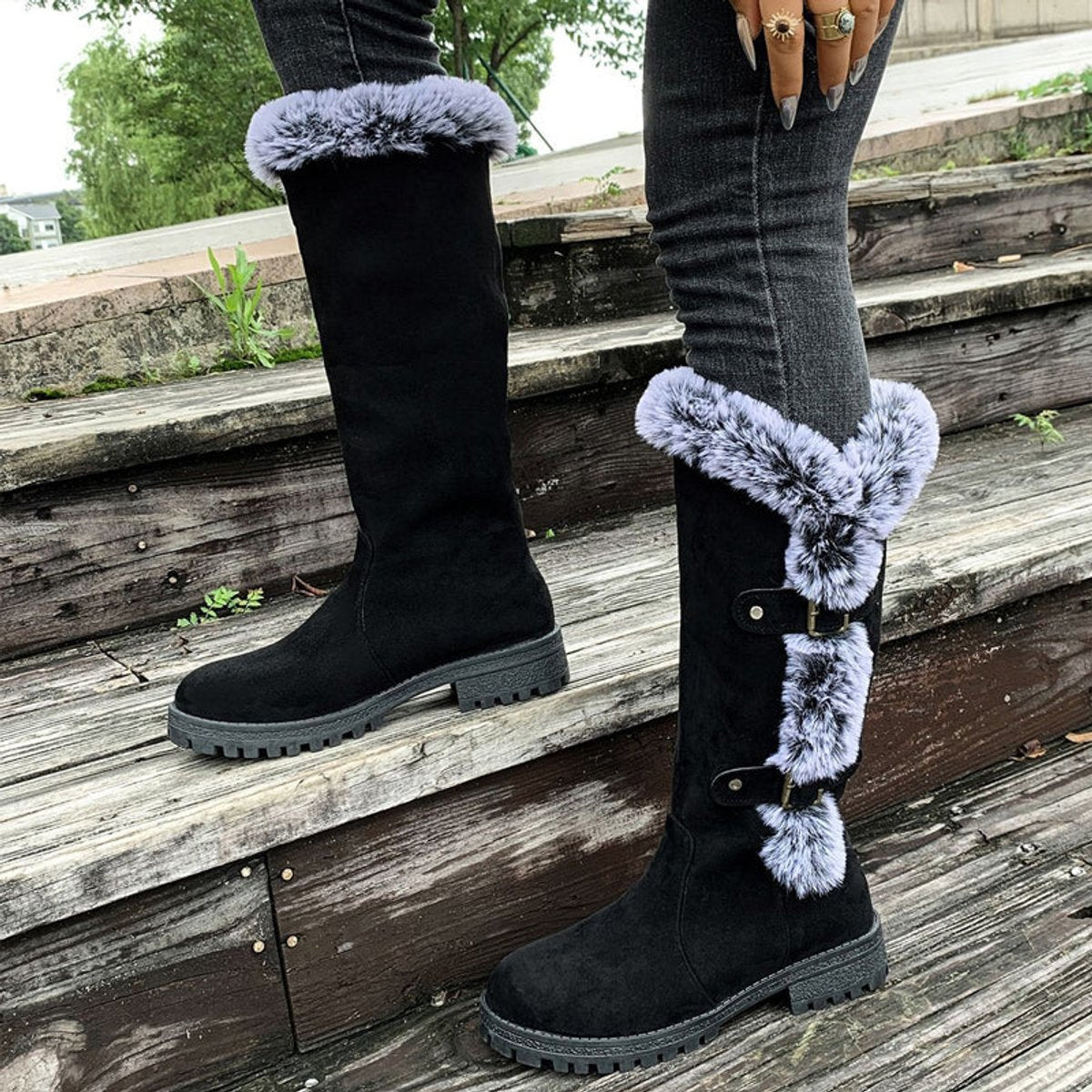 Black knee high boots featuring plush faux fur trim and adjustable buckle straps, perfect for women seeking stylish and warm long boots for cold weather. 8