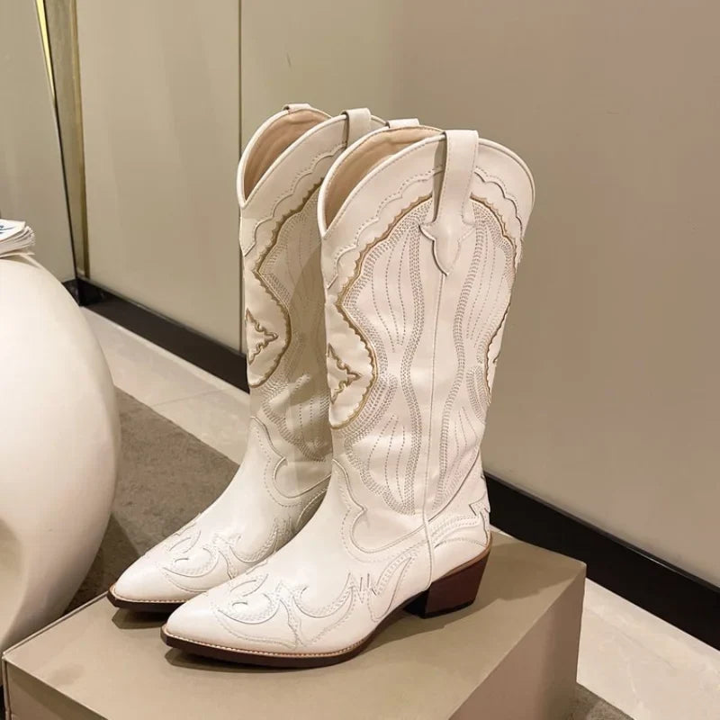 Beige cream embroidered cowboy boots with pointed toe, front view