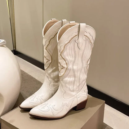 Beige cream embroidered cowboy boots with pointed toe, front view