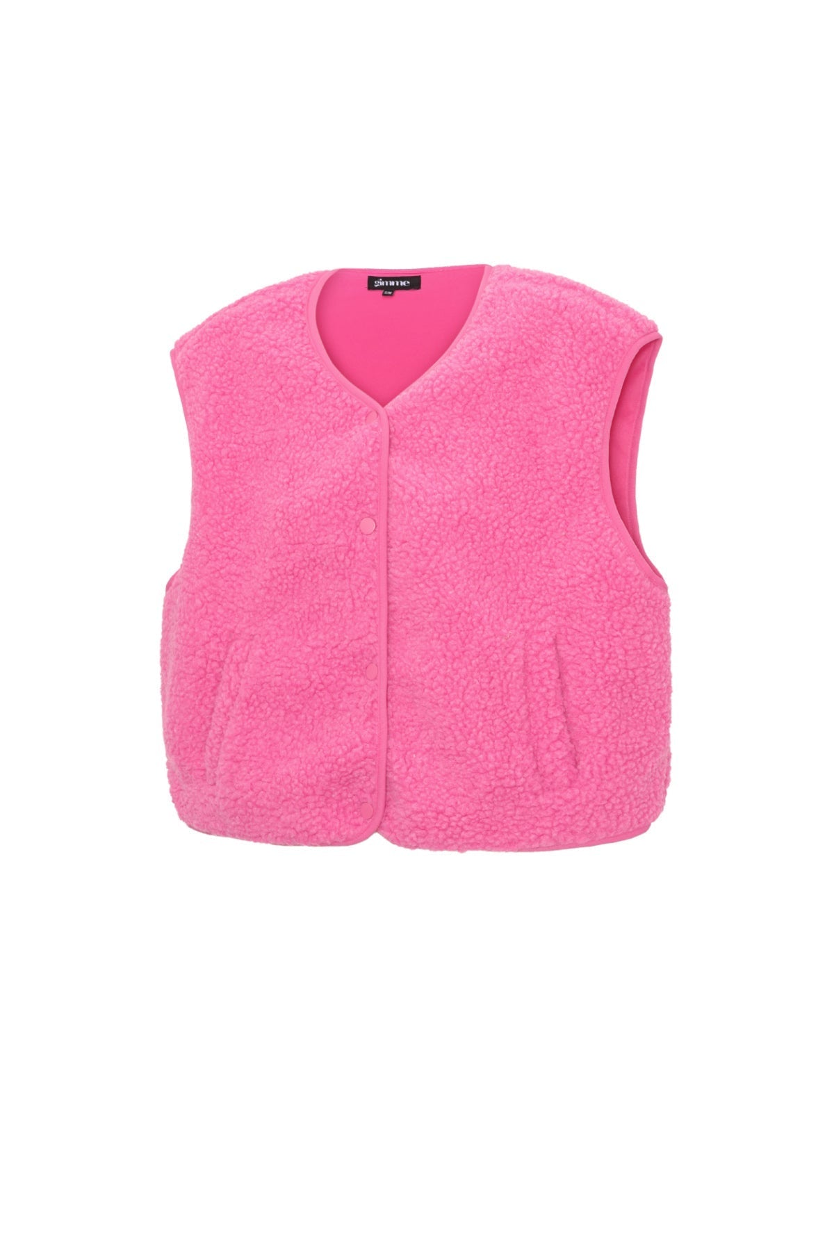 Roze mouwloos teddy vest met V-hals, plat gefotografeerd op witte achtergrond | Boutique Moda