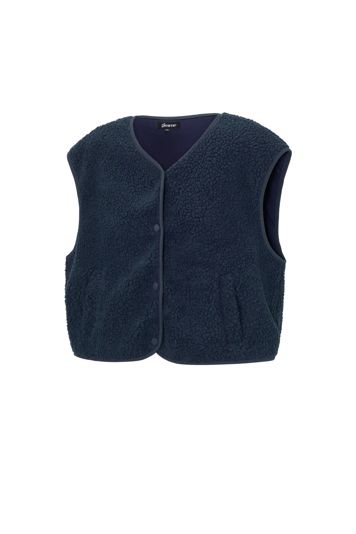 Donkerblauw mouwloos teddyvest van fleece, plat gefotografeerd op witte achtergrond | Boutique Moda