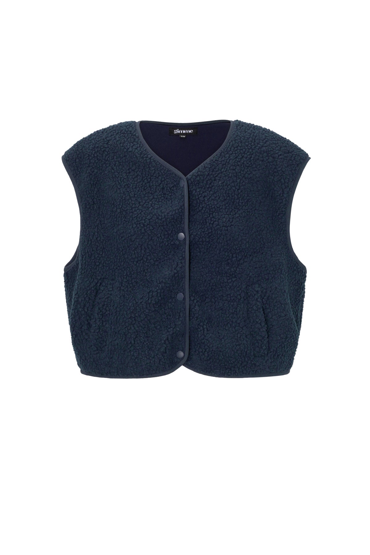 Donkerblauw mouwloos teddy vest met knopen, plat gefotografeerd | Boutique Moda