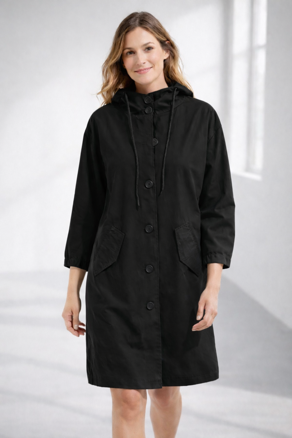 Black hooded longline winter coat with patch pockets