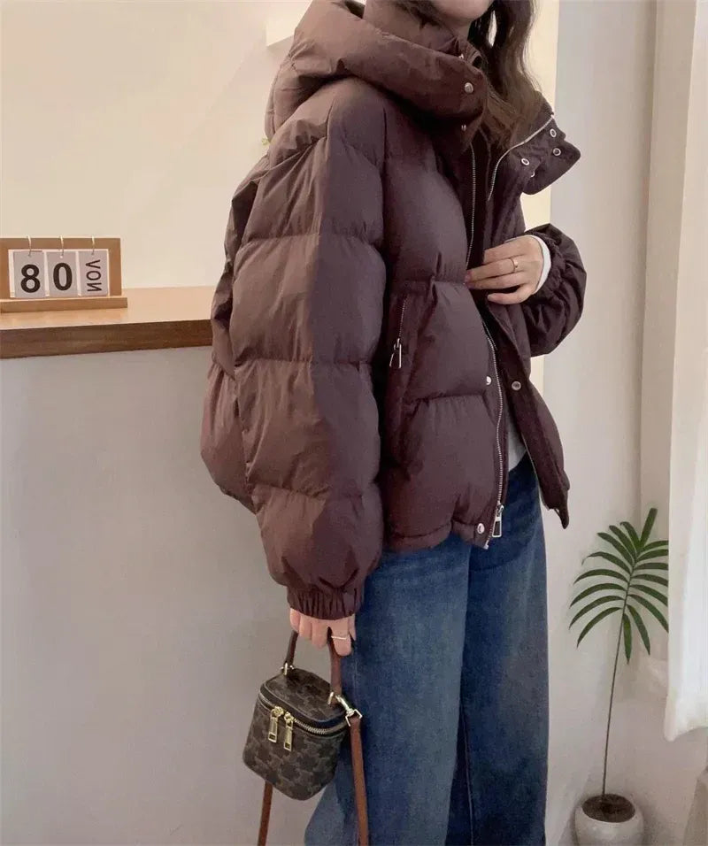 High neck quilted hooded puffer jacket with a zip up front