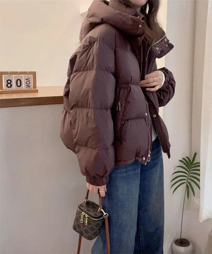 High neck quilted hooded puffer jacket with a zip up front